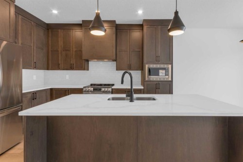 1325 South Point Parade Sw, Airdrie, AB - Indoor Photo Showing Kitchen With Upgraded Kitchen
