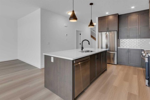 1325 South Point Parade Sw, Airdrie, AB - Indoor Photo Showing Kitchen With Double Sink With Upgraded Kitchen