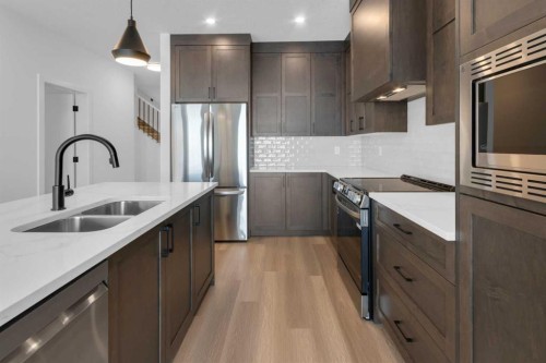 1325 South Point Parade Sw, Airdrie, AB - Indoor Photo Showing Kitchen With Double Sink With Upgraded Kitchen
