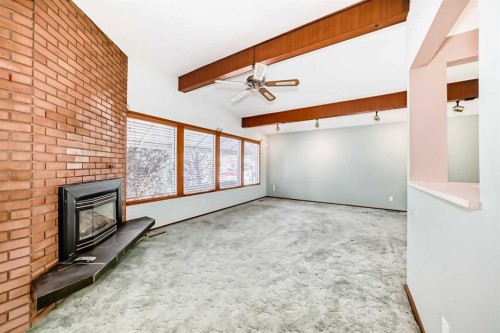 332 Wascana Crescent Se, Calgary, AB - Indoor Photo Showing Other Room With Fireplace