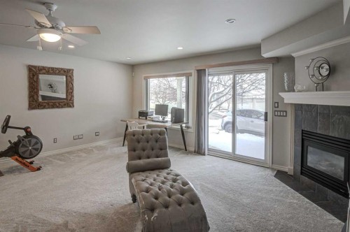 96 Hampstead Green Nw, Calgary, AB - Indoor Photo Showing Living Room With Fireplace
