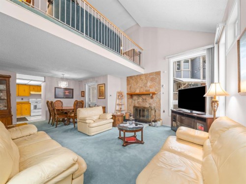 29 Millrise Lane Sw, Calgary, AB - Indoor Photo Showing Living Room With Fireplace