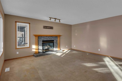 111 Hillview Road, Strathmore, AB - Indoor Photo Showing Living Room With Fireplace
