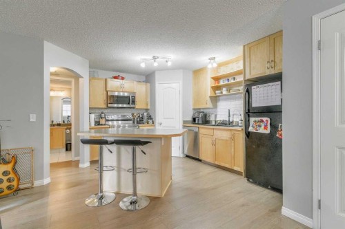 105-27 Everridge Square Sw, Calgary, AB - Indoor Photo Showing Kitchen With Double Sink