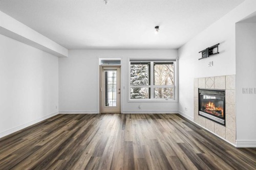 108-11642 Valley Ridge Park Nw, Calgary, AB - Indoor With Fireplace