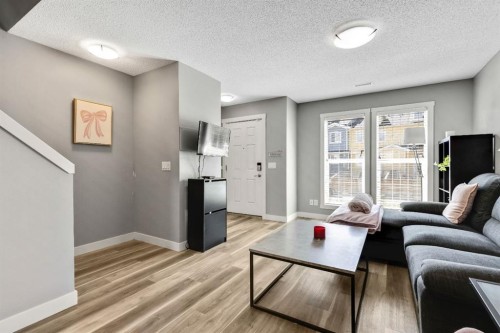 220 Mckenzie Towne Close Se, Calgary, AB - Indoor Photo Showing Living Room
