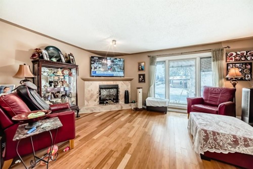 274 Templeview Way Ne, Calgary, AB - Indoor Photo Showing Living Room With Fireplace