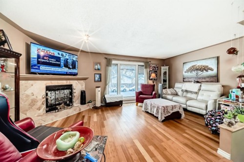 274 Templeview Way Ne, Calgary, AB - Indoor Photo Showing Living Room With Fireplace