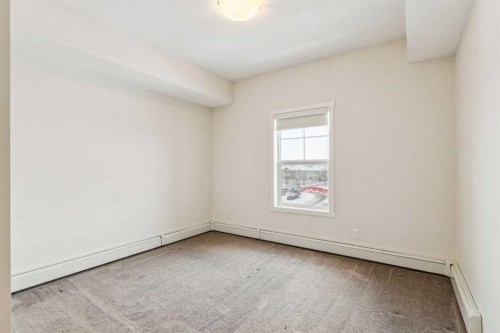 9312-101 Sunset Drive, Cochrane, AB - Indoor Photo Showing Other Room
