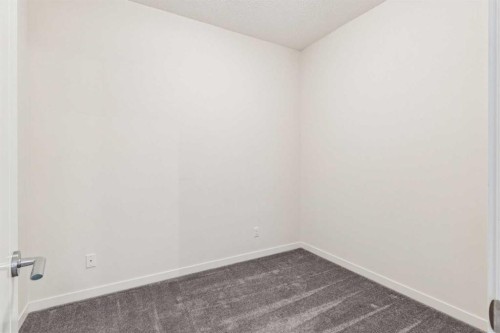 9312-101 Sunset Drive, Cochrane, AB - Indoor Photo Showing Other Room