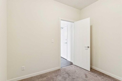 9312-101 Sunset Drive, Cochrane, AB - Indoor Photo Showing Other Room