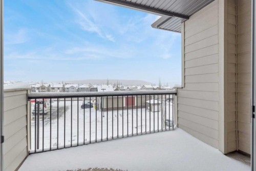 9312-101 Sunset Drive, Cochrane, AB - Outdoor With Balcony With Exterior