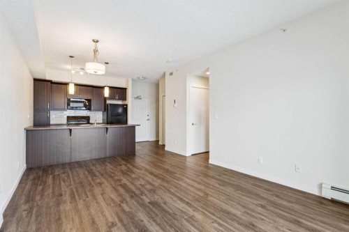 9312-101 Sunset Drive, Cochrane, AB - Indoor Photo Showing Kitchen