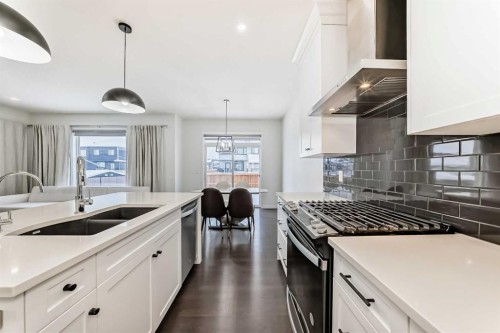 31 Creekside Grove Sw, Calgary, AB - Indoor Photo Showing Kitchen With Double Sink With Upgraded Kitchen