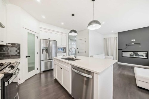 31 Creekside Grove Sw, Calgary, AB - Indoor Photo Showing Kitchen With Stainless Steel Kitchen With Double Sink With Upgraded Kitchen