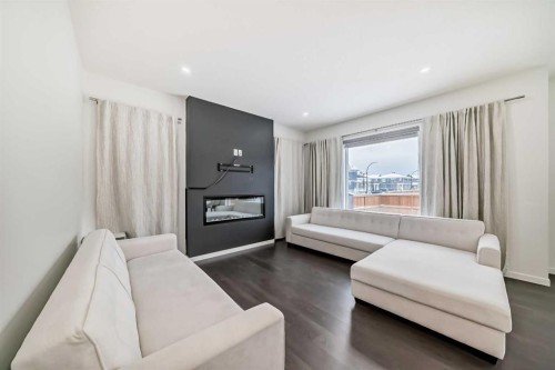 31 Creekside Grove Sw, Calgary, AB - Indoor Photo Showing Living Room With Fireplace