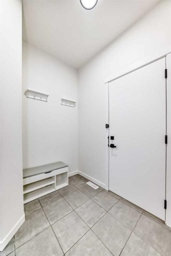31 Creekside Grove Sw, Calgary, AB - Indoor Photo Showing Other Room