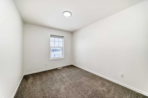 31 Creekside Grove Sw, Calgary, AB - Indoor Photo Showing Other Room