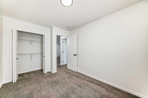 31 Creekside Grove Sw, Calgary, AB - Indoor Photo Showing Other Room