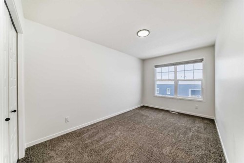 31 Creekside Grove Sw, Calgary, AB - Indoor Photo Showing Other Room