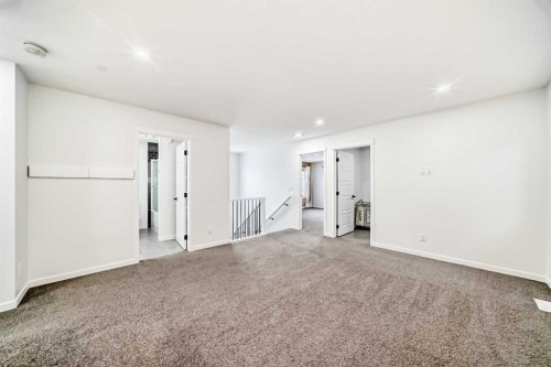 31 Creekside Grove Sw, Calgary, AB - Indoor Photo Showing Other Room