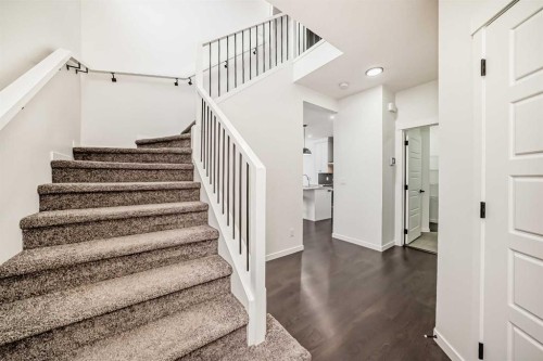 31 Creekside Grove Sw, Calgary, AB - Indoor Photo Showing Other Room