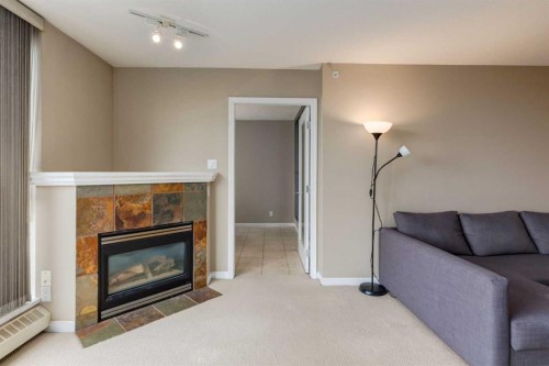 604-650 10 Street Sw, Calgary, AB - Indoor Photo Showing Living Room With Fireplace
