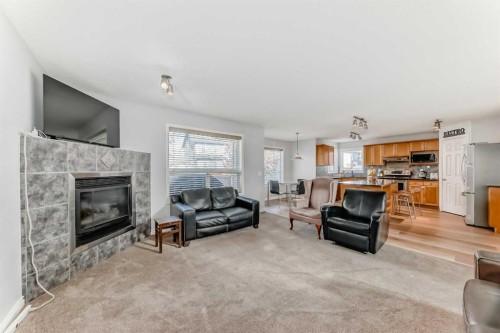 307 Panatella Court Nw, Calgary, AB - Indoor Photo Showing Living Room With Fireplace