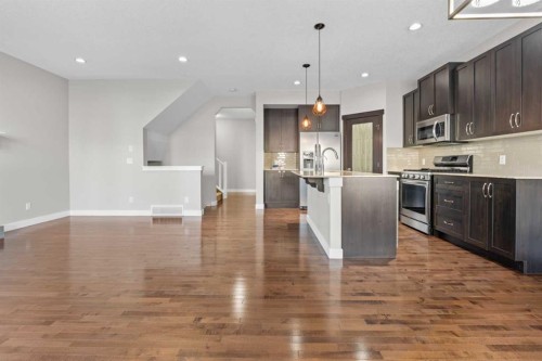 24 Panatella Square Nw, Calgary, AB - Indoor Photo Showing Kitchen With Upgraded Kitchen