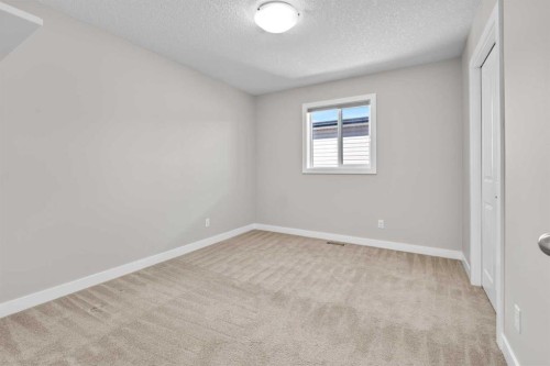 24 Panatella Square Nw, Calgary, AB - Indoor Photo Showing Other Room