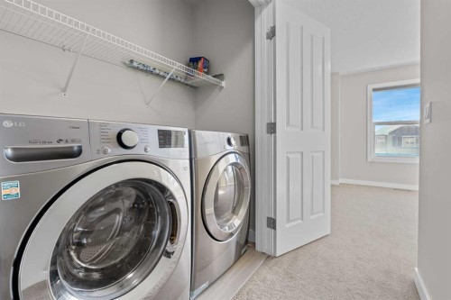 24 Panatella Square Nw, Calgary, AB - Indoor Photo Showing Laundry Room