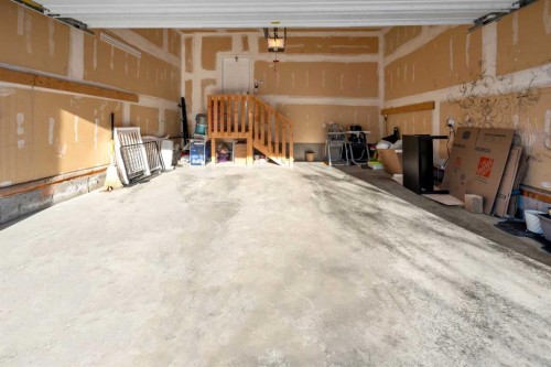 24 Panatella Square Nw, Calgary, AB - Indoor Photo Showing Garage