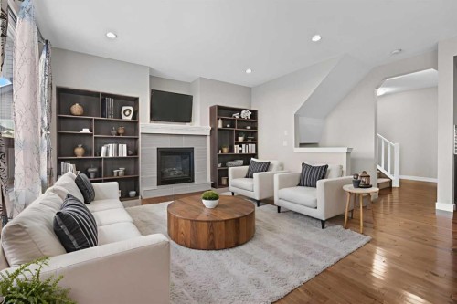24 Panatella Square Nw, Calgary, AB - Indoor Photo Showing Living Room With Fireplace