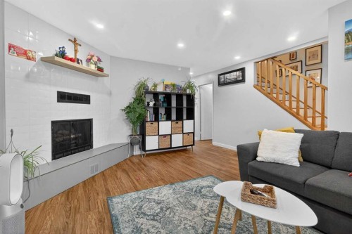 1451 Berkley Drive Nw, Calgary, AB - Indoor Photo Showing Living Room With Fireplace