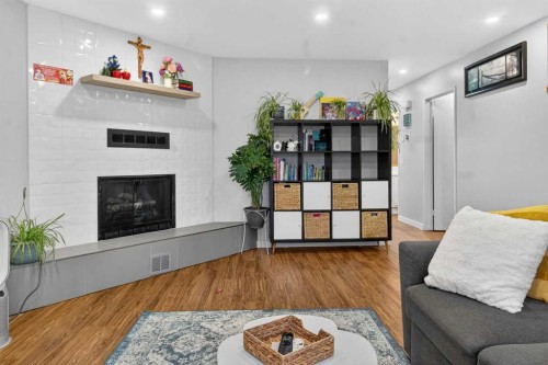 1451 Berkley Drive Nw, Calgary, AB - Indoor Photo Showing Other Room With Fireplace