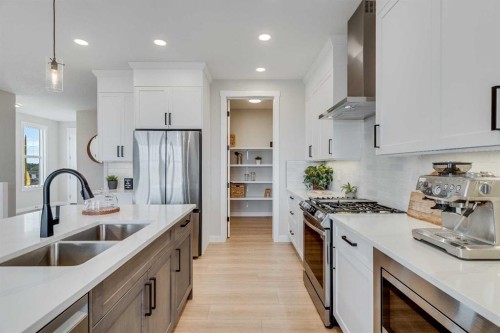 471 Kinniburgh Loop, Chestermere, AB - Indoor Photo Showing Kitchen With Double Sink With Upgraded Kitchen