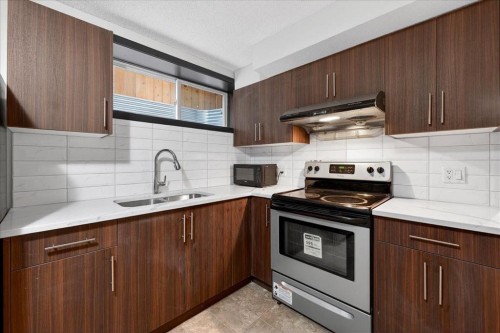 135 Skyview Springs Manor Ne, Calgary, AB - Indoor Photo Showing Kitchen With Double Sink