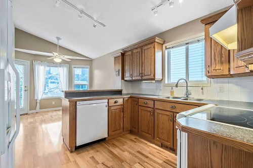 13 Sheep River Link, Okotoks, AB - Indoor Photo Showing Kitchen With Double Sink
