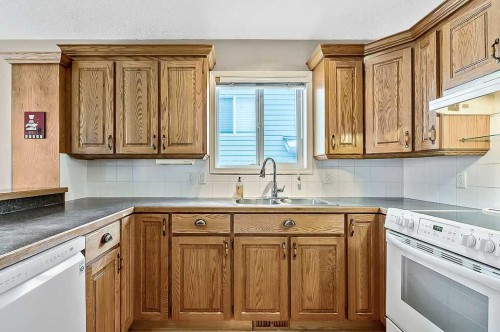 13 Sheep River Link, Okotoks, AB - Indoor Photo Showing Kitchen With Double Sink