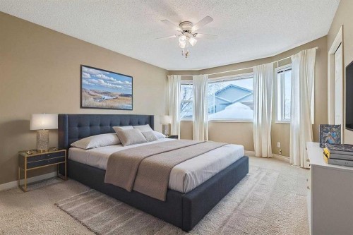 13 Sheep River Link, Okotoks, AB - Indoor Photo Showing Bedroom