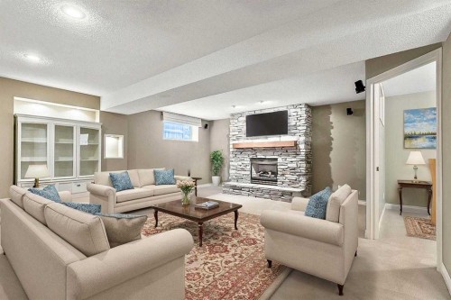 13 Sheep River Link, Okotoks, AB - Indoor Photo Showing Living Room With Fireplace