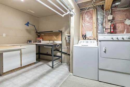 13 Sheep River Link, Okotoks, AB - Indoor Photo Showing Laundry Room