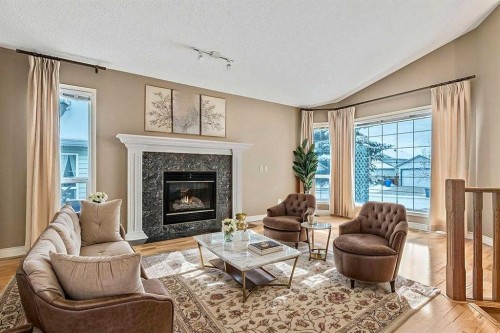 13 Sheep River Link, Okotoks, AB - Indoor Photo Showing Living Room With Fireplace