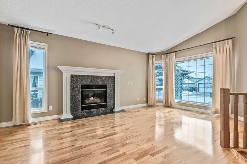 13 Sheep River Link, Okotoks, AB - Indoor Photo Showing Living Room With Fireplace
