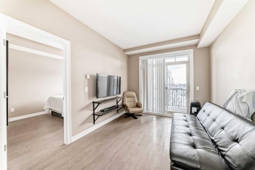 311-117 Copperpond Common Se, Calgary, AB - Indoor Photo Showing Living Room