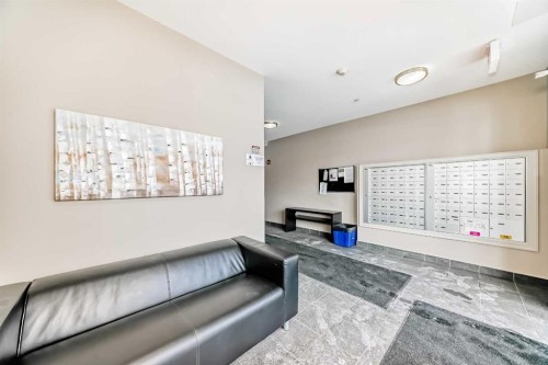 311-117 Copperpond Common Se, Calgary, AB - Indoor With Fireplace