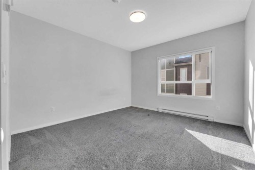 201-360 Harvest Hills Way Ne, Calgary, AB - Indoor Photo Showing Other Room