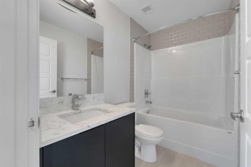 201-360 Harvest Hills Way Ne, Calgary, AB - Indoor Photo Showing Bathroom
