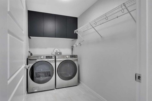 201-360 Harvest Hills Way Ne, Calgary, AB - Indoor Photo Showing Laundry Room
