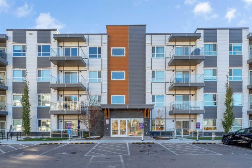 201-360 Harvest Hills Way Ne, Calgary, AB - Outdoor With Balcony With Facade